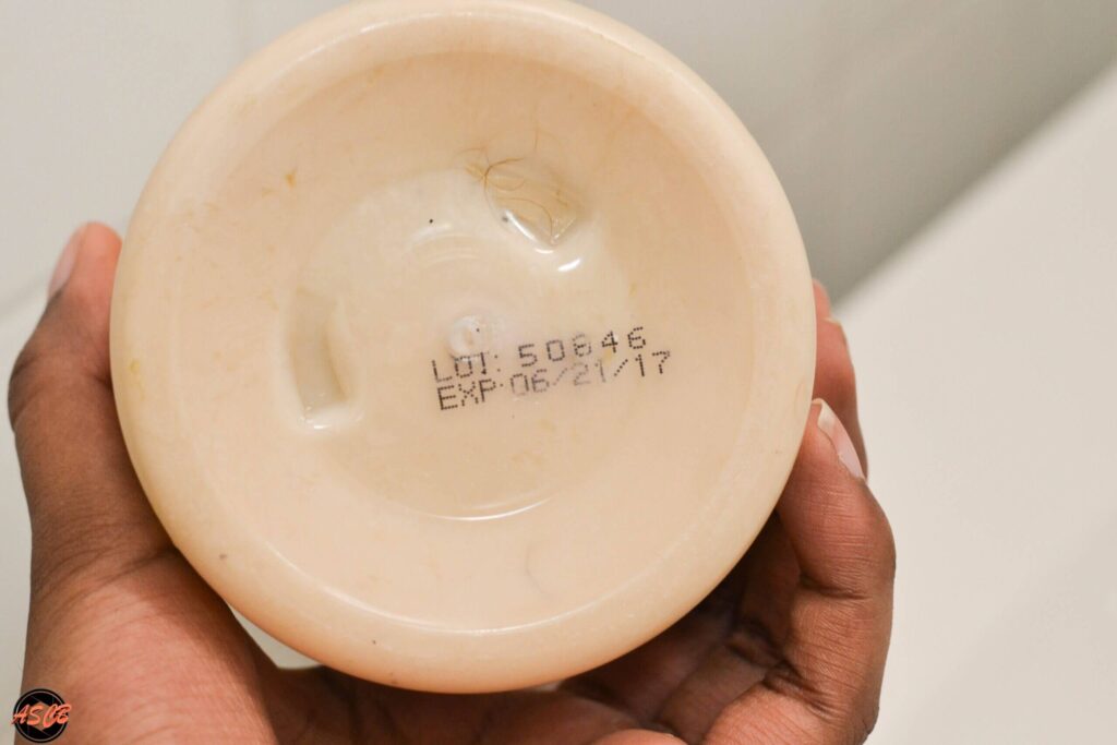 Close-up of a different Shea Moisture product base displaying an expiration date of EXP: 06/21/17.