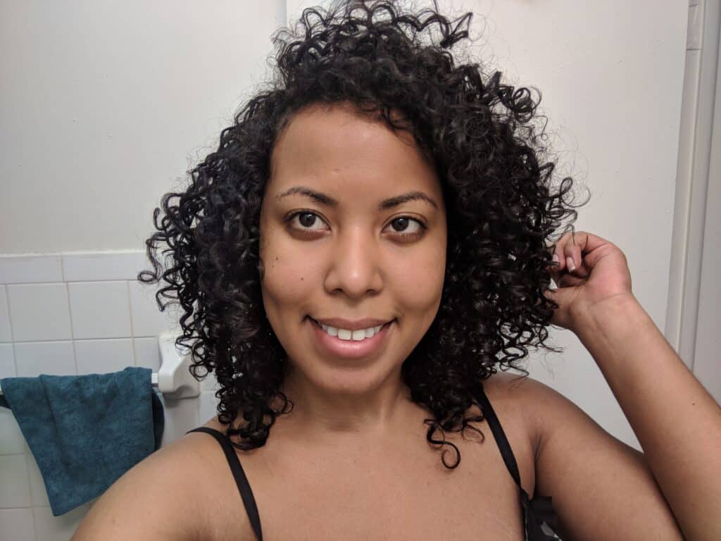 Curly hair after transitioning from damage to healthier, defined curls