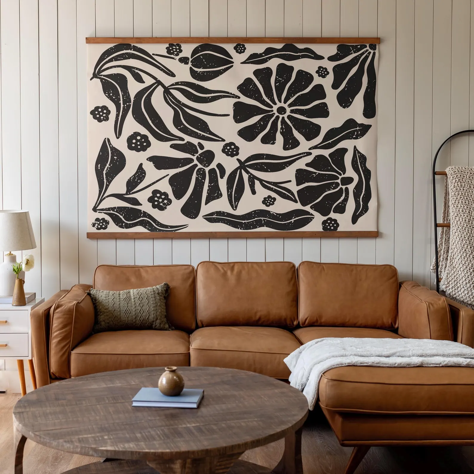 Extra-large boho tapestry wall art in soft earth tones, styled in a bright, minimalist room with neutral furniture and indoor plants. Lightweight and toddler-friendly.