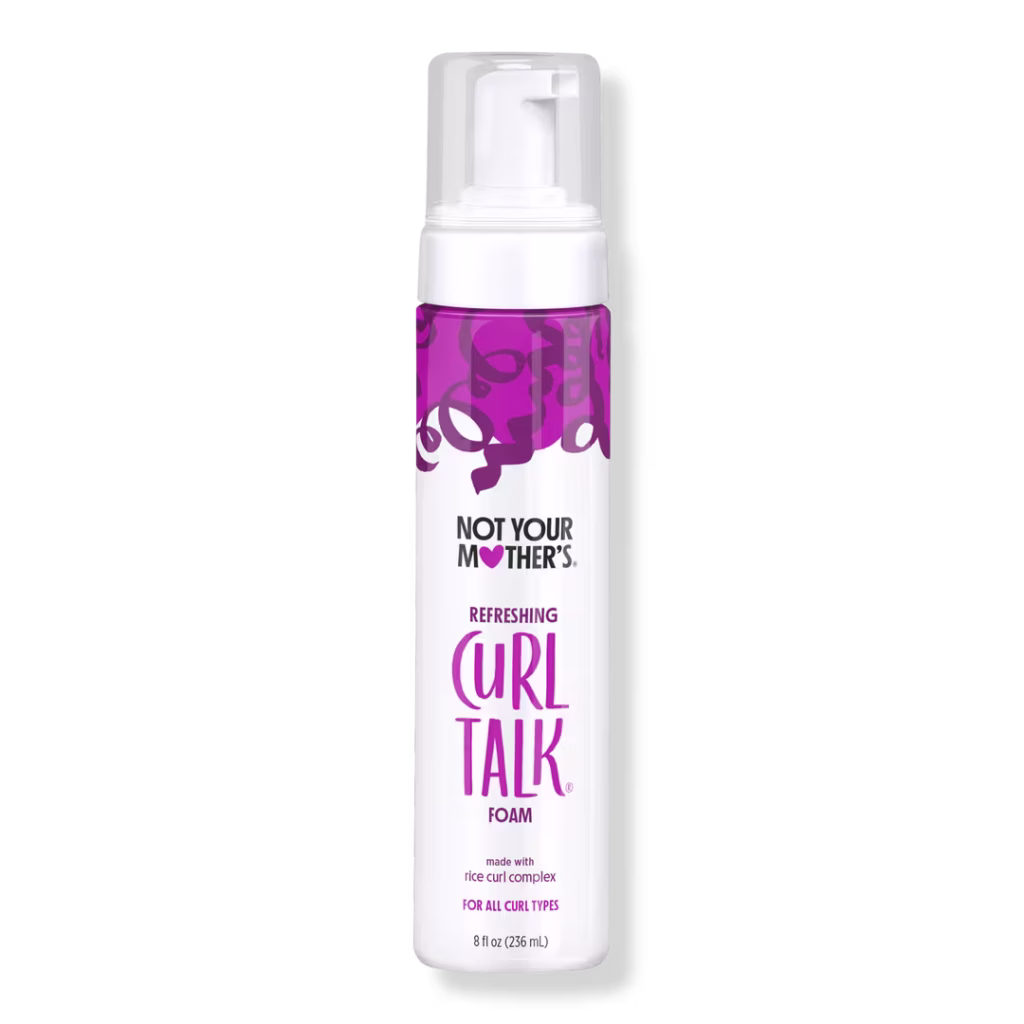 Not Your Mother’s Curl Talk Curl Foam in a white and purple bottle, designed to enhance curl pattern and reduce frizz for natural hair.