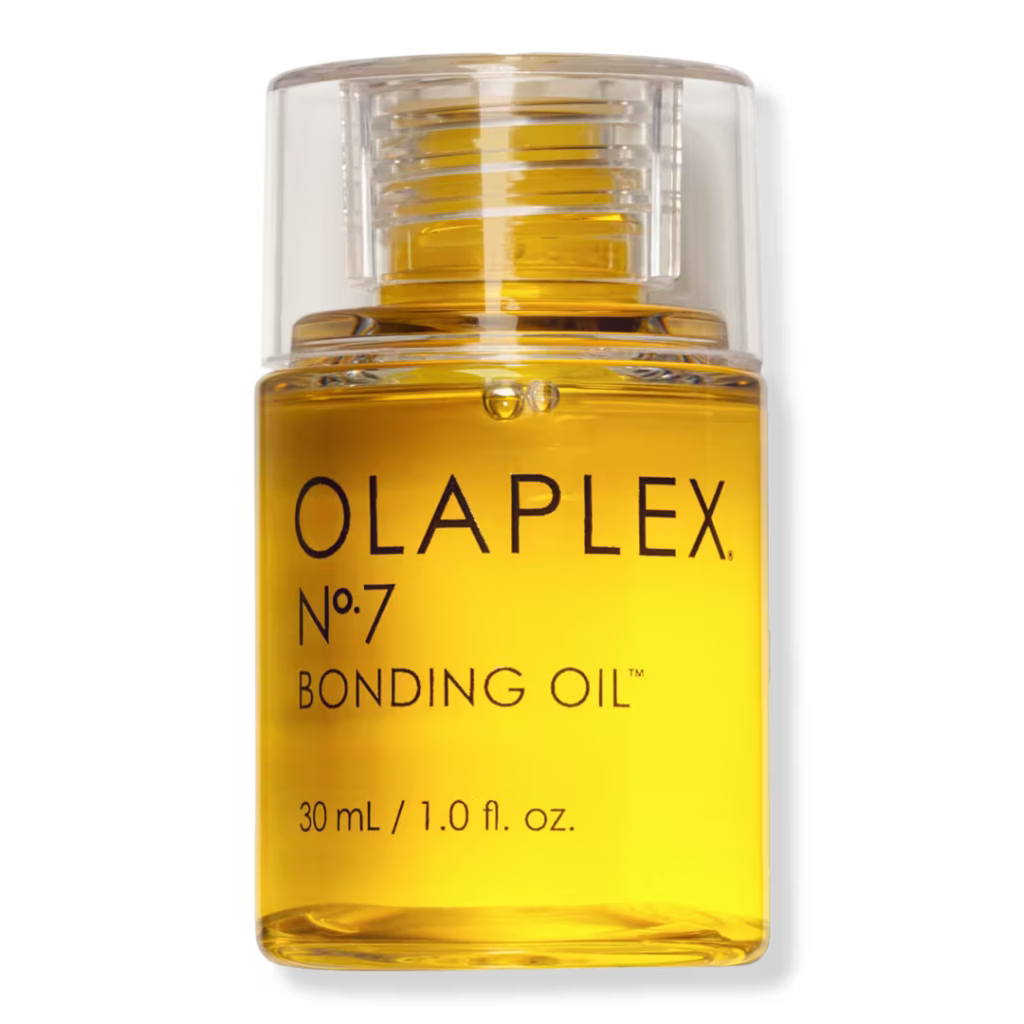 Olaplex No. 7 Bonding Oil in a clear pump bottle filled with golden yellow oil