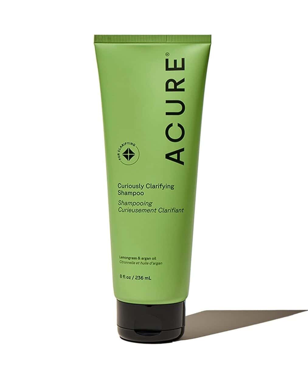 Green tube of Acure Curiously Clarifying Shampoo with lemongrass and argan oil